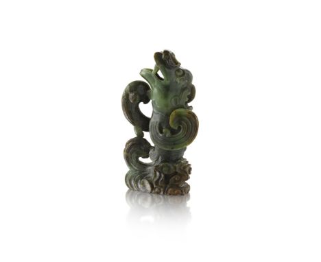 SPINACH-GREEN JADE 'DRAGON-CARP' VASEQING DYNASTY, 18TH/19TH CENTURY the vessel formed as a carp metamorphosing into a dragon