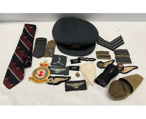 A WWII RAF officers peak cap with badge, uniform patches, squadron patch, tie and a monacle scope.Condition ReportCap with mi