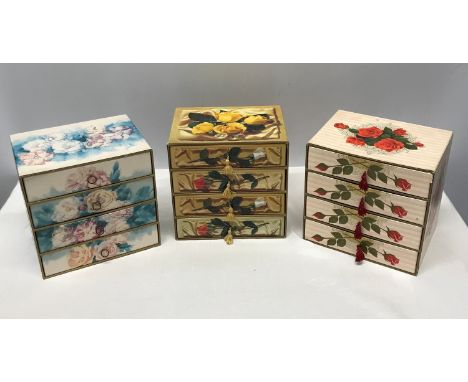 A collection of 3 floral cardboard 4 draw jewellery boxes with decorative design to all 3 and pull tassel and ring openings, 