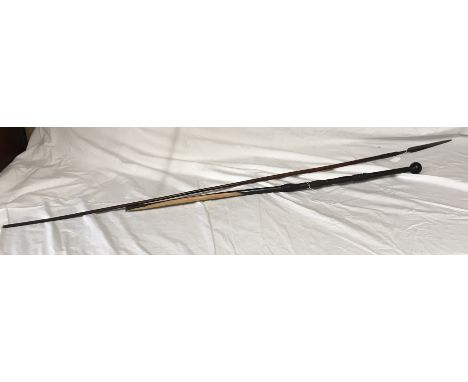 An African carved ebony walking stick with knob handle 96cms l together with an African tribal spear with wood shaft with met
