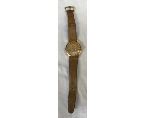 An Omega 18ct gold Seamaster automatic wristwatch with original leather strap and 9ct buckle clasp. Stamped 750 to inner case