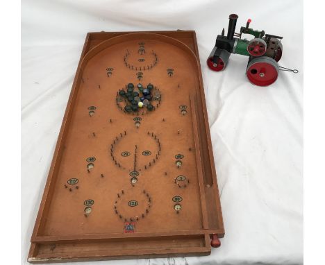 A Mamod steam roller model , 18cms h x 23cms l together with a bagatelle marble game by Chad Valley including marbles.Conditi