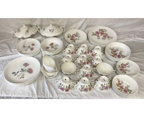 A quantity of Wedgewood dinnerware. Twenty one  pieces of "Flame Rose" to include: 6 dinner plates 26cms d, 6 small plates 21