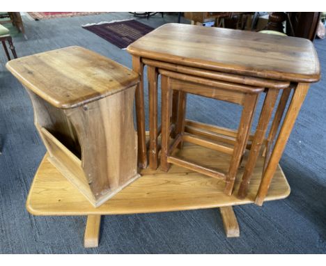 A pine nest of 3 tables, 57 w x 40 d x 52cms h, a lightwood coffee table, 107 w x 50 d x 32cms h, magazine rack side table, 4