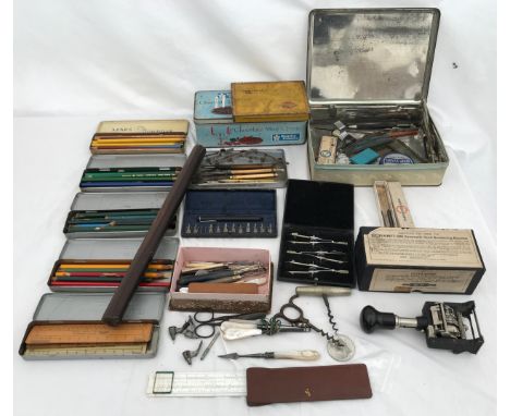 A quantity of stationery to include various coloured pencils, rulers, compasses, Leda Hand numbering machine, two corkscrews 
