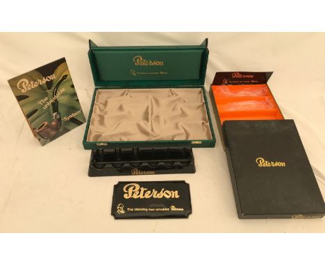 A collection of Peterson pipe tobacco shop display boxes, stands and counter top advertising cards.Condition ReportDust grime