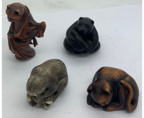 Four various wood and resin netsukes to include seated bear, signed to base, monkey with baby signed to base and 2 cats. All 