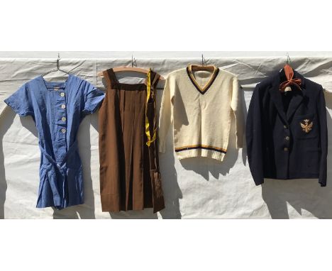 A selection of girls School uniform to include a navy blazer with eagle and crown crest in gold embroidery to left chest pock