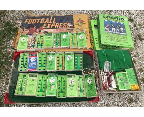 A Subbuteo table soccer and Football Express table with 11 boxed, various complete football teams and one other mixed team of