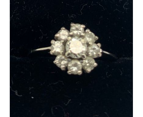 An 18ct white gold diamond cluster ring, size J. 2.7gms total weight.Condition ReportGood condition.