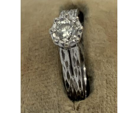 A solitaire diamond ring set in 18ct white gold. Size M. 3.1gms.Good condition.