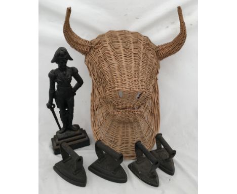 A cast iron doorstep of The duke of Wellington 41cms h, four hot irons and a large wicker wall mounted bulls head approx. 55c