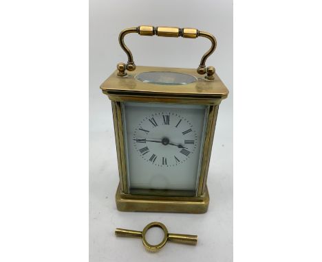 A brass carriage clock with key. 14cms h.Condition ReportGood condition.