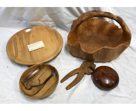 A Tasmanian Sassafras wood fruit bowl 32cms w, small bowl 17cms, lidded wooden bowl 12cms , carved nut cracker and a wood bas