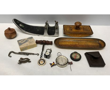 A mixed lot to include ski attachment and ski polish, printed blotter and pen tray, cork screw, compass, Sundo altimeter, key