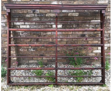A large stained pine wall mounted plate shelf. 182cms w x 144cms h x 21cms d.Condition ReportFairly good, some nibbles to she