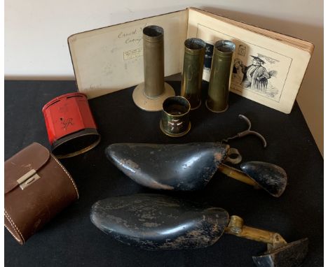 A miscellany including brass shell cases, WWI sketch book, shoe trees, gentlemen's hairbrushes, corkscrew and Chad Valley mon