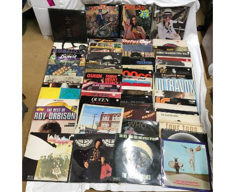 A collection of 60 vinyl LP records of British 70's &amp; 80's rock charts by various artists to include: The Rolling Stones,