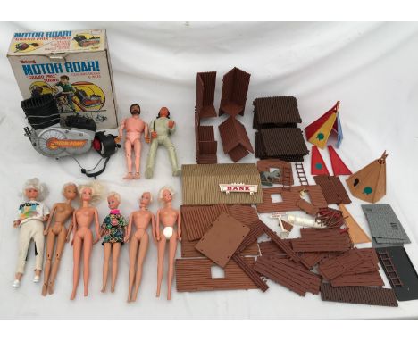 A selection of children's toys to include palitoy action man, marx apache, Triang Motor Roar with box, four Mattel Barbie typ