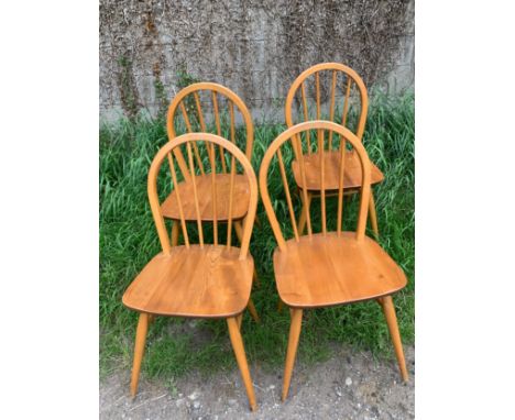 Four Ercol dining chairs.Condition ReportSome scuff marks to legs, otherwise good.