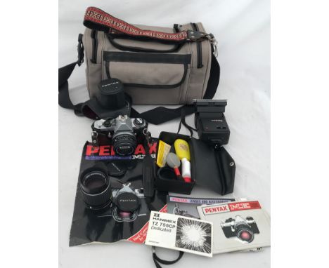 A Pentax M.E. Super camera with carry bag and accessories, cleaning kit, Hanimex TZ 755, flash unit,135mm lens, strap and boo