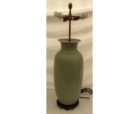 A large Chinese style lamp with green glaze and scroll leaf design. Approx. 88cms h x 28cms w with 4 light fittings.Condition