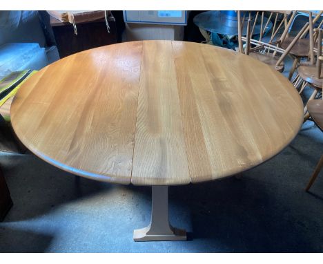 A light coloured 1970's Ercol dining table, 140cms extended. 127 w x 22cms closed. 72cms h.Condition ReportGood condition.