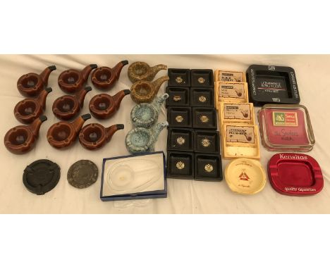 A selection of ashtrays and pipe bowls, 12 ceramic ashtrays in the form of a smoking pipe, 10 Sobranie ashtrays, Swan vestas 