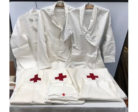 A selection of Medical uniforms to include 2 x Doctors white coat, 1 x female Doctor/Matrons white coat with tie waist, 3 x N