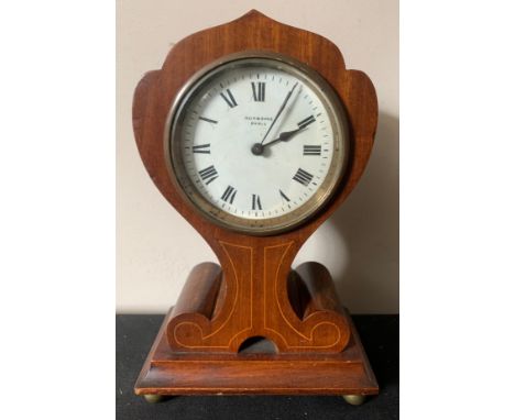 A mahogany Art Nouveau mantle clock with string inlay, raised on brass ball feet. Reid &amp; Sons Paris.Condition ReportCrack