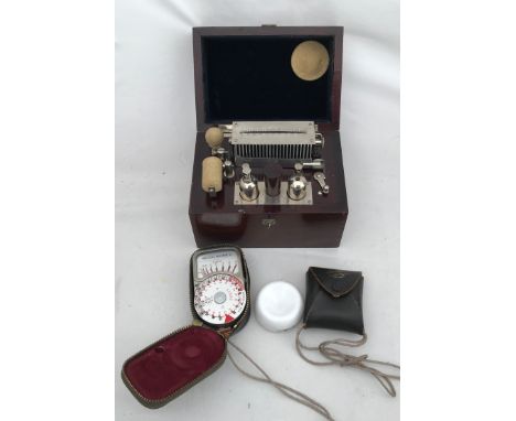 A mahogany cased Ever-Ready test machine. 17cms w x 11.5cms d x 12.5cms h together with a Weston master light meter.Condition