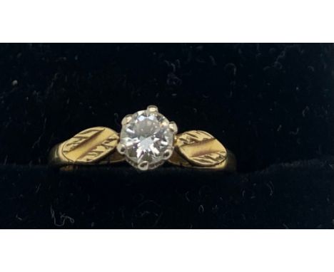 A diamond solitaire ring set in 18ct yellow gold. Size L. 2.9gms total weight. The diameter of the diamond is approx. 4mm.