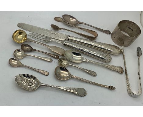 Hallmarked silver to include napkin ring, sugar tongs, salt and mustard spoon berry spoon etc. 250.3gms total.