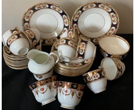 An early 20thC tea service including 2 bread and butter plates, 8 cups, 10 saucers, 10 plates, sugar bowl, 2 odd cups and one