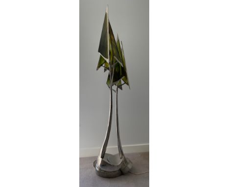 A steel sculpture standard lamp with green glass conical shades and twin stem. 207 h, base width approx 55 w x 38cms.Conditio