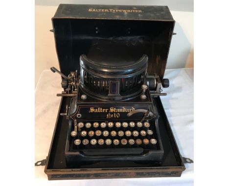 An early 1900's Salter standard No. 10 typewriter  black enamelled with original tin carry case.Condition ReportSome enamel w