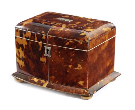 λ A REGENCY TORTOISESHELL TEA CADDYEARLY 19TH CENTURYof bowfront form, with pewter stringing, the hinged lid enclosing a twin