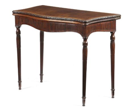 A GEORGE III MAHOGANY SERPENTINE CARD TABLEC.1780-90the kingwood crossbanded fold-over top with a carved ribbon and laurel ed