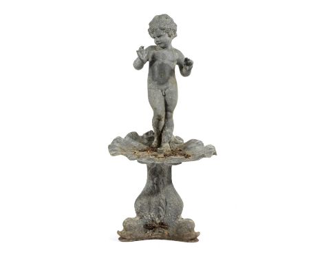 A LEAD FOUNTAINEARLY 20TH CENTURYmodelled as a naked boy standing above a shell shaped dish, on a dolphin tripod base76cm hig