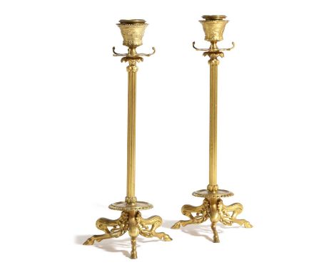 A PAIR OF FRENCH GILT BRONZE CANDLESTICKSBY F. BARBEDIENNE & CIE, MID-19TH CENTURYeach with a flaring nozzle above a drip tra