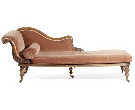 λ A RARE VICTORIAN IRISH WALNUT CAMPAIGN CHAISE LONGUEBY ROSS OF DUBLIN, C.1860the dismantlable frame carved with scrolling l