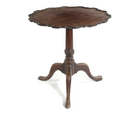 A GEORGE III MAHOGANY TRIPOD TABLEC.1760the tilt-top with a moulded pie-crust edge on a turned stem and spiral fluted bowl73c