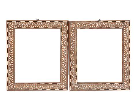 λ A PAIR OF ANGLO-INDIAN HARDWOOD WALL MIRRORS HOSHIARPUR, LATE 19TH / EARLY 20TH CENTURYeach with a later rectangular plate,