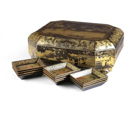 A CHINESE EXPORT BLACK LACQUER GAMES BOXC.1820-40decorated in gilt with panels of figures in various pursuits possibly tea ma