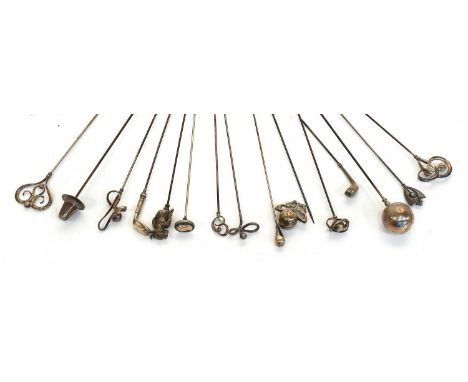 A Collection of Mainly Silver Early 20th Century Hat Pins, comprising six scrolling and a Welsh hat example by Charles Horner