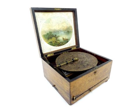 Walnut cased table-top Polyphon, playing 9.5" discs, 12.25" wide (in need of restoration)