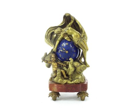 Unusual small brass and marble mantel clock timepiece, the blue painted globe dial enclosed by the brass figure of a semi-nud