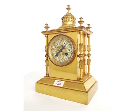 French gilt brass two train mantel clock striking on a gong, within a pillared stepped case surmounted by an architectural fi