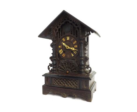 Black Forest two train cuckoo clock, within a carved gabled case, 18" high (pendulum and keys, missing cornice)