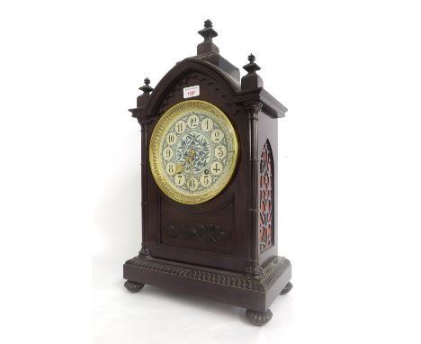 Mahogany Arts & Crafts two train Gothic ting-tang mantel clock, the W & H movement striking on two gongs, the painted dial si